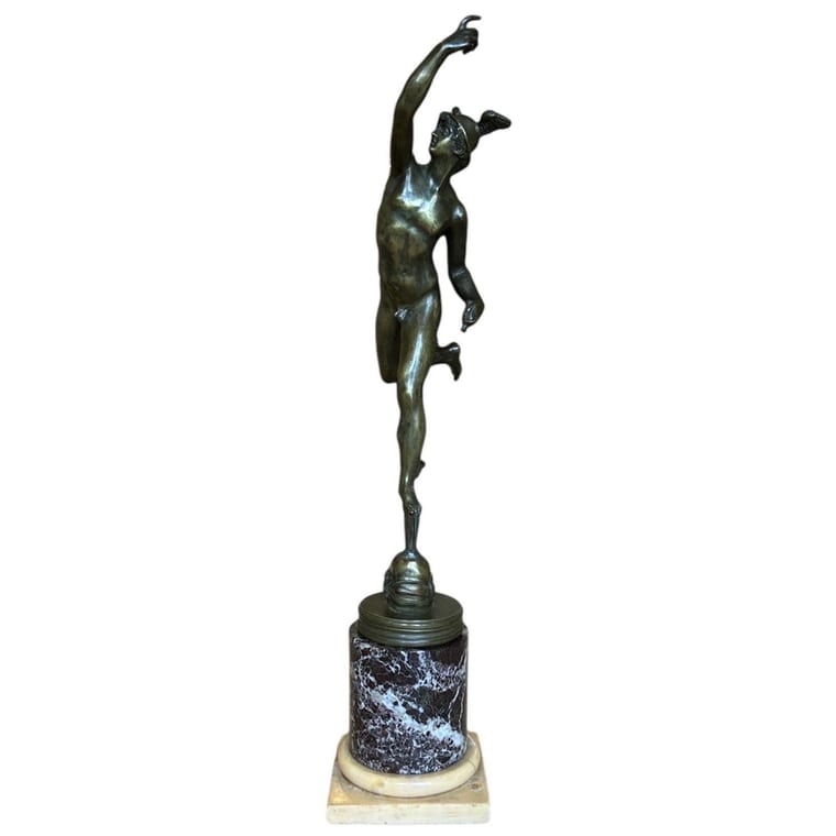 A Grand Tour bronze figure of Mercury ( Hermes ) on a marble collum